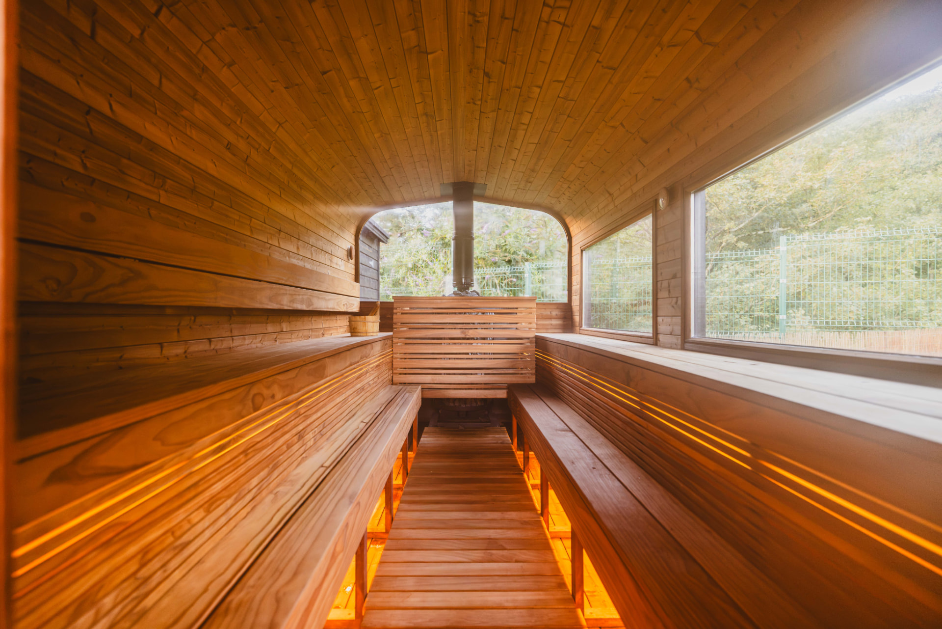 Warm timber benches inside the PikeNHot sauna